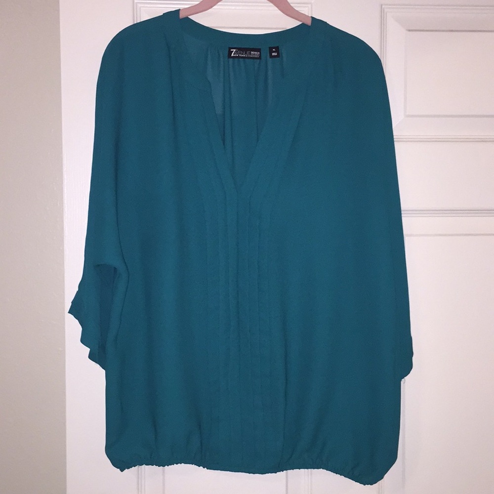 Pleated banded bottom blouse
